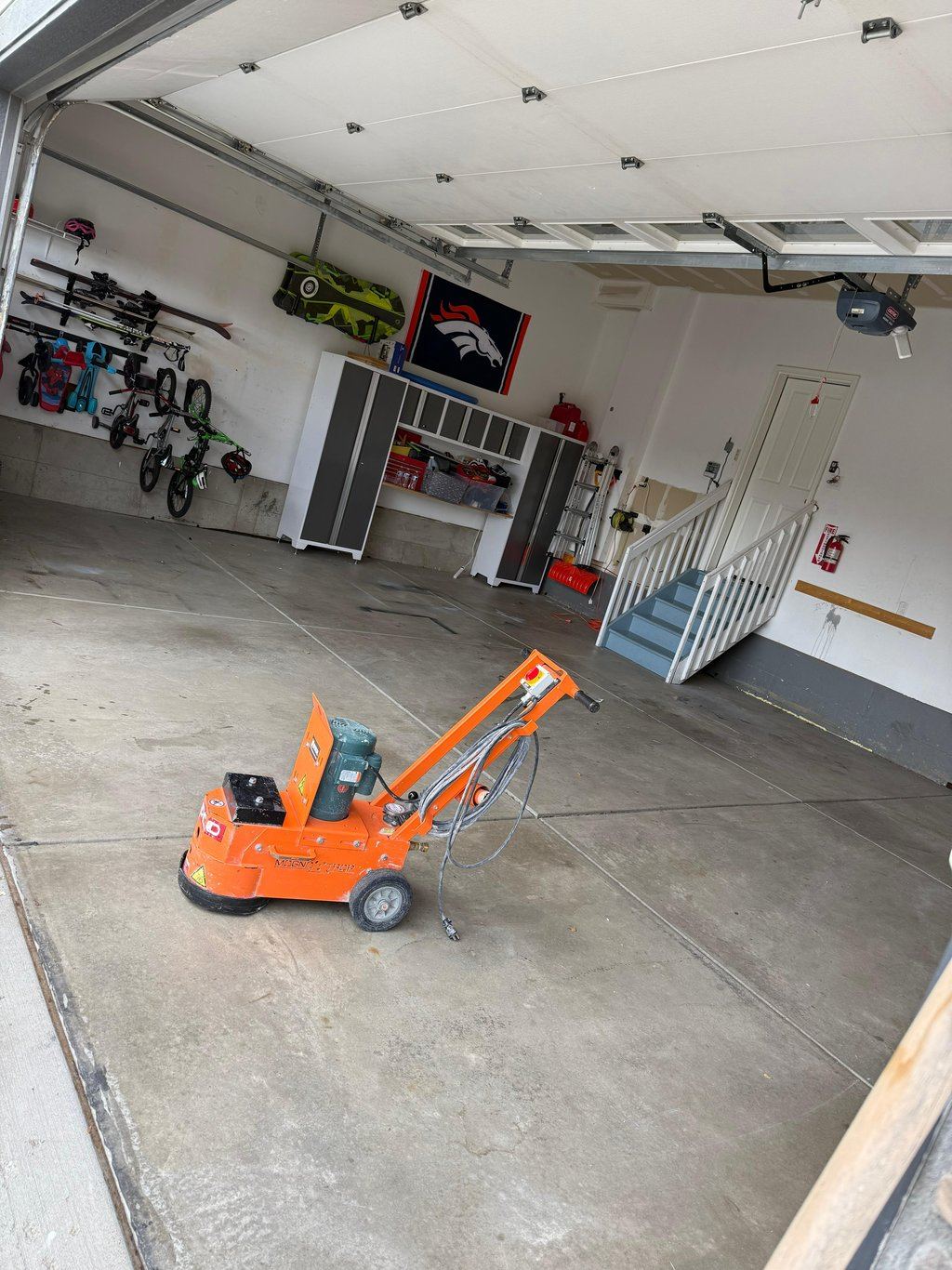 Before: Cracked concrete garage floor needing epoxy coating