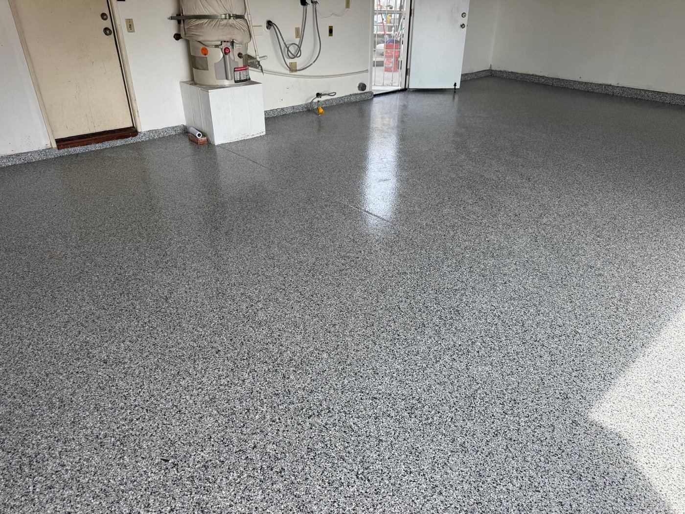 BM Epoxy grinding garage floor with professional equipment